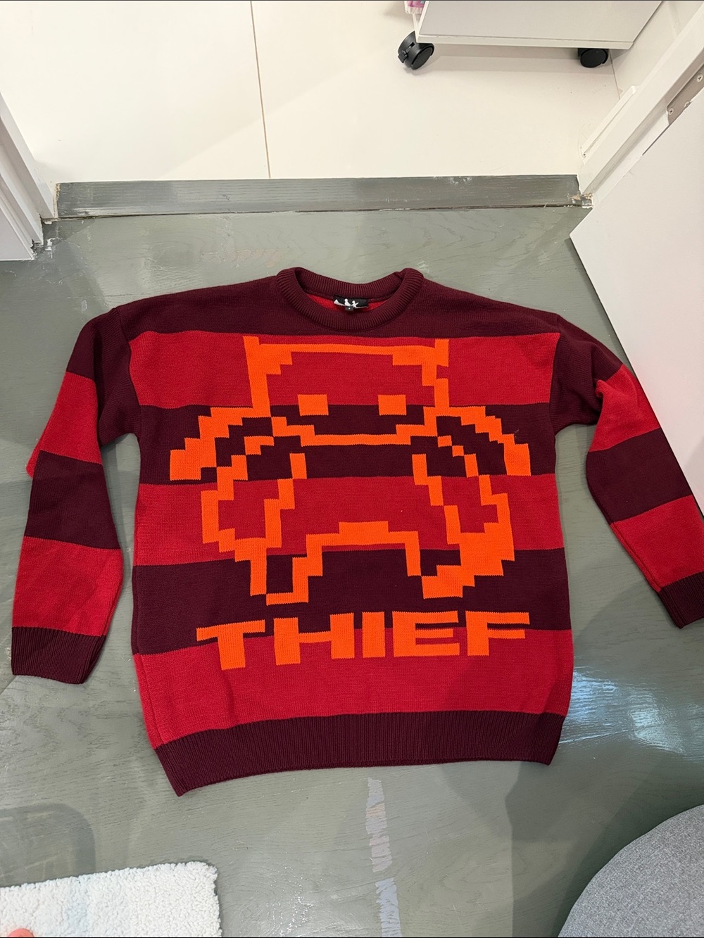 Men's Burgundy & Red Striped Crewneck Sweater with Orange Pixel Graphic